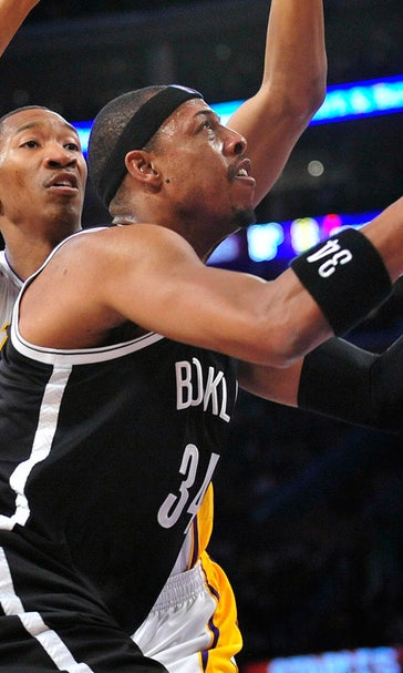 Jason Collins back in NBA, Nets beat Lakers 108-102